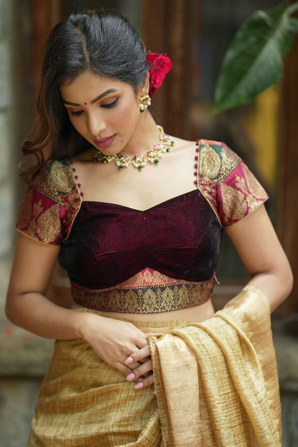 Burgundy velvet and banarasi brocade sweetheart neck blouse with potli