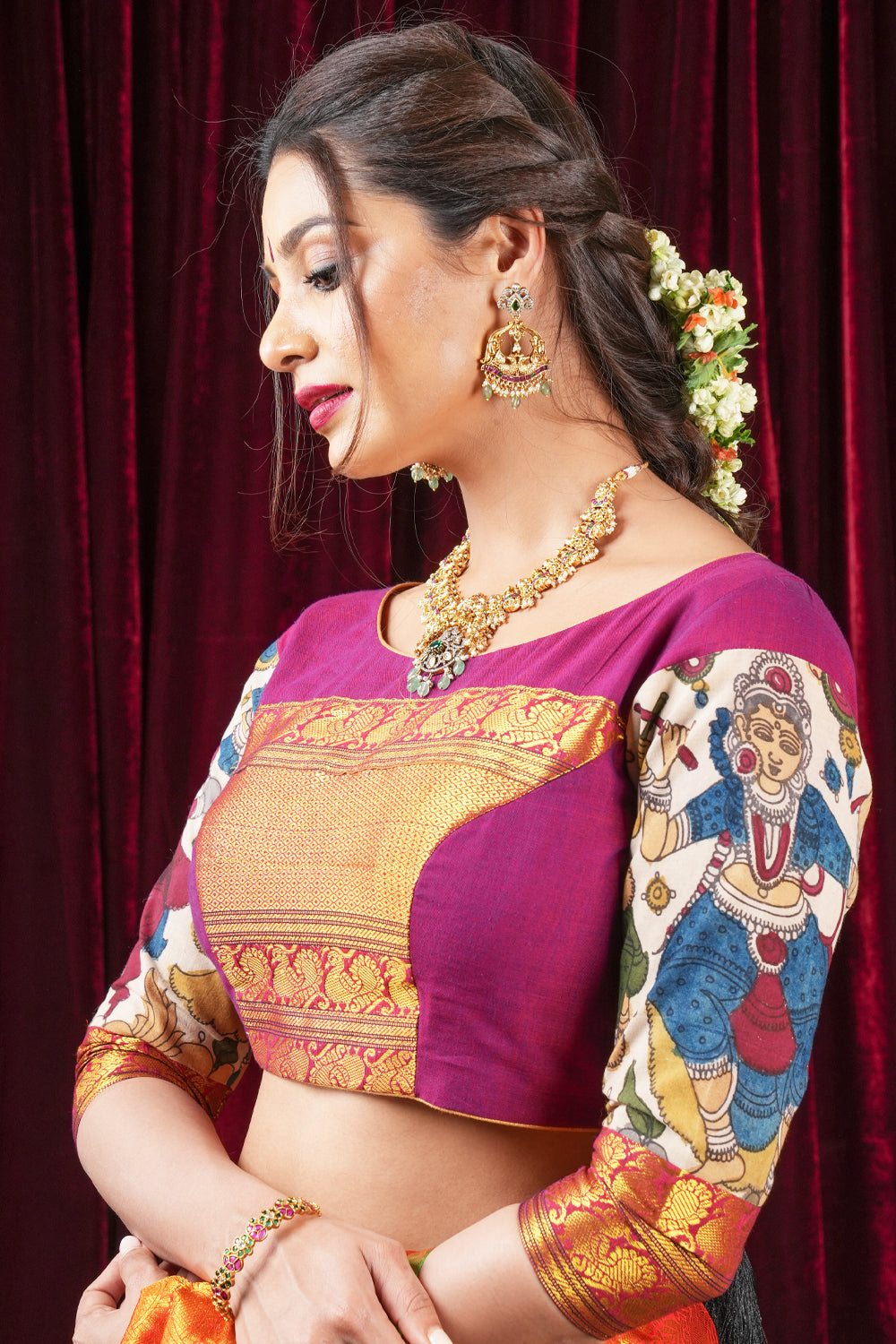 Plum narayanpet cotton boatneck blouse with 3/4th kalamkari sleeves and zari patch.