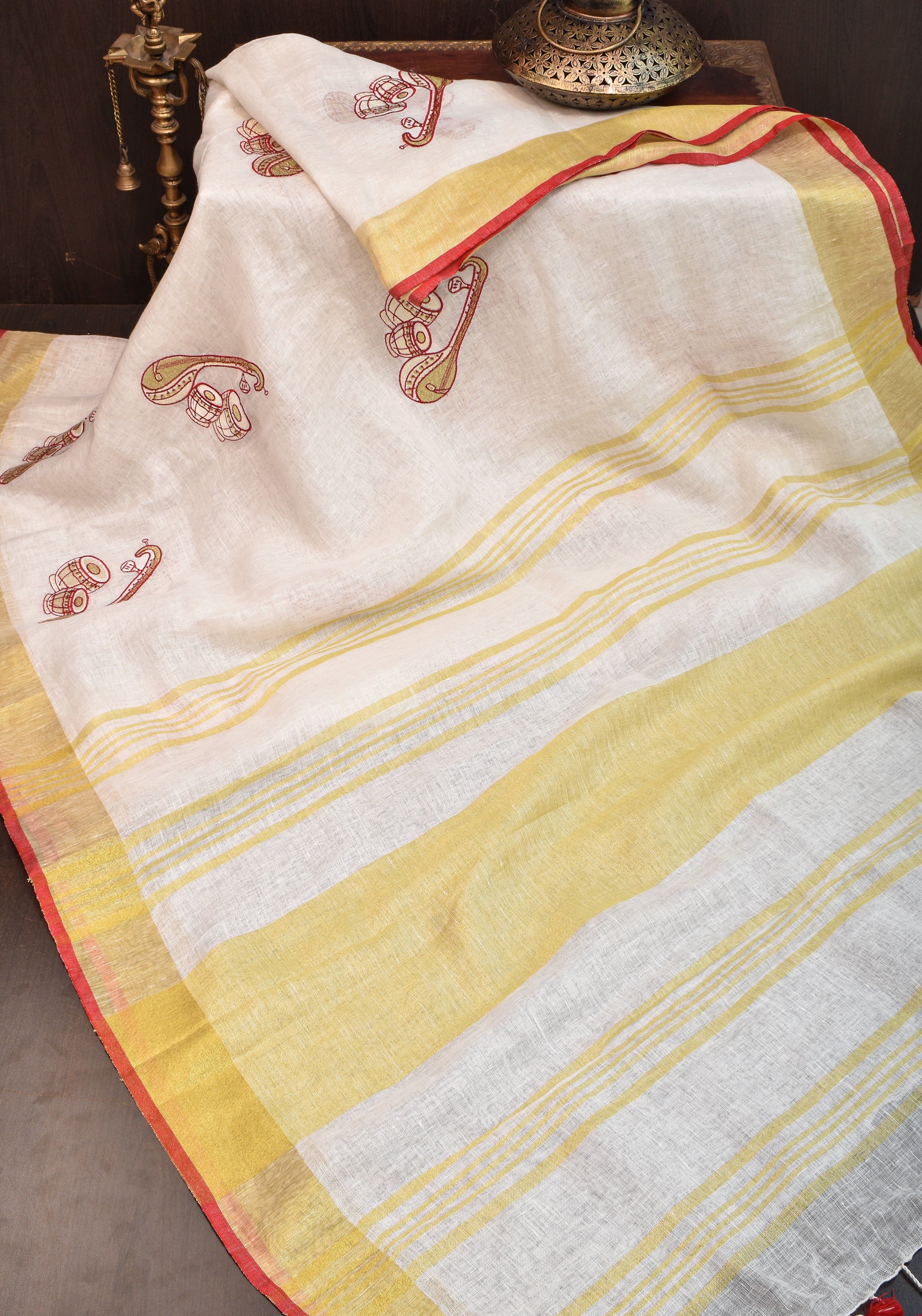 Linen by Linen Saree in White with Musical instruments embroidery motifs