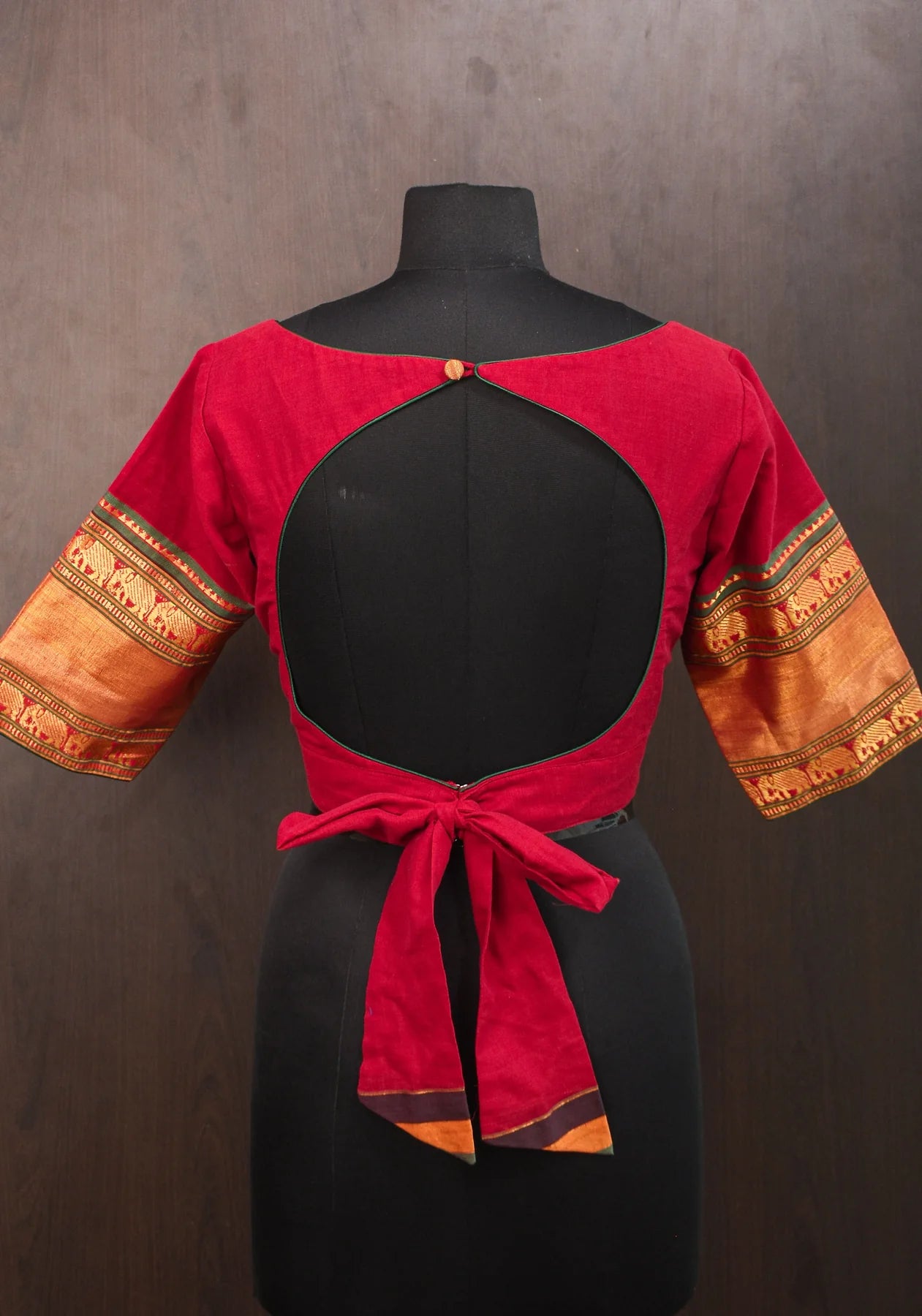 Maroon Narayanpet cotton boatneck blouse with oval cutout and tieback design