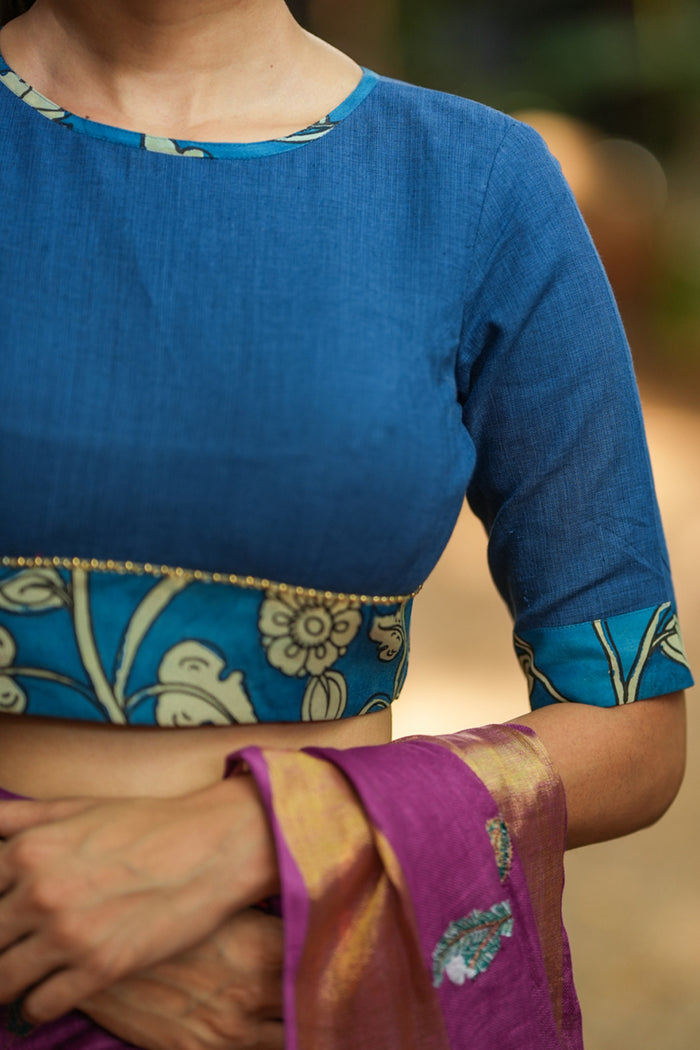 Saphire blue closed neck handloom blouse with handpainted kalamkari bo