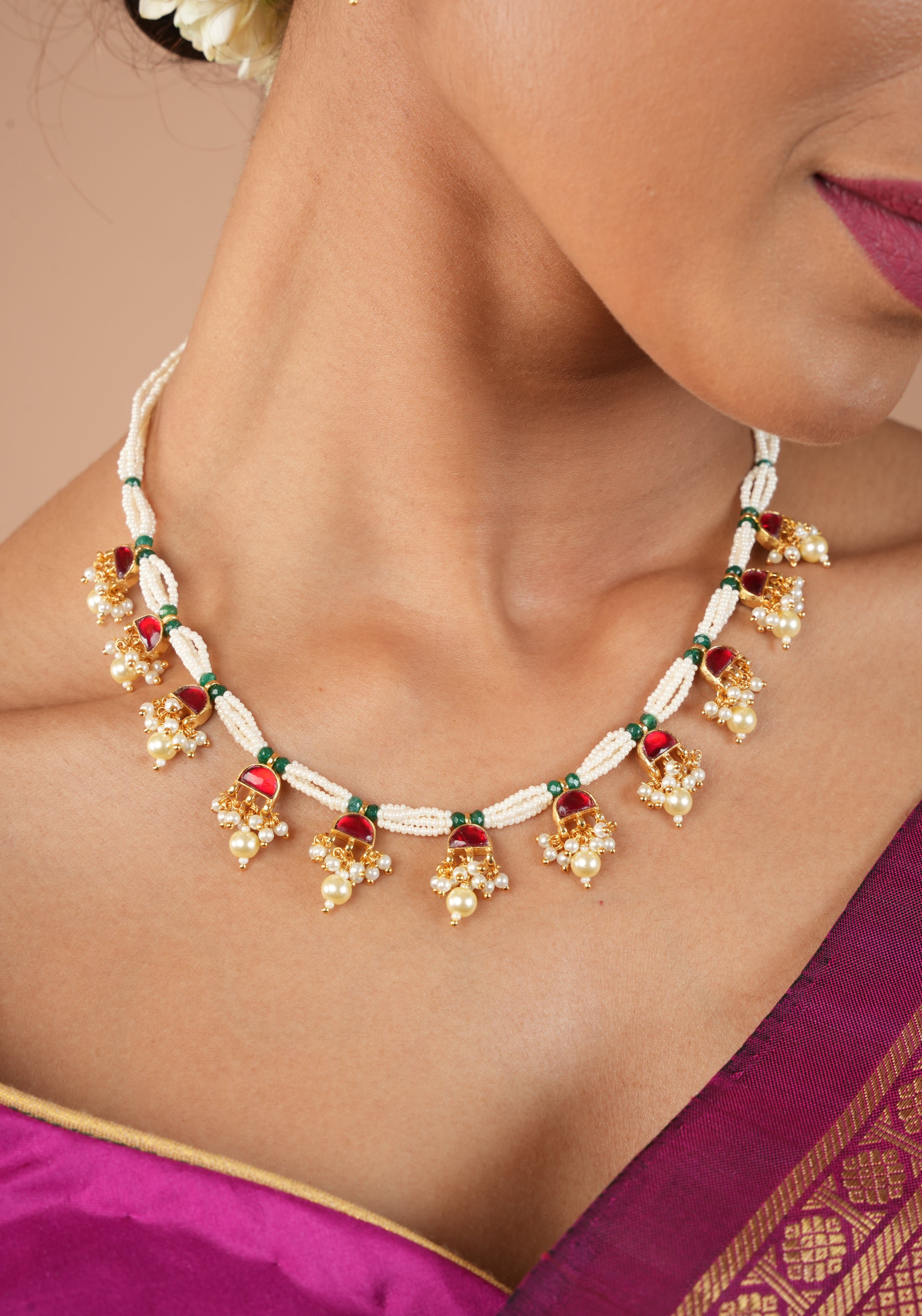 Lightweight Jadau Necklace Set with eleven dangling red stones and matching earrings