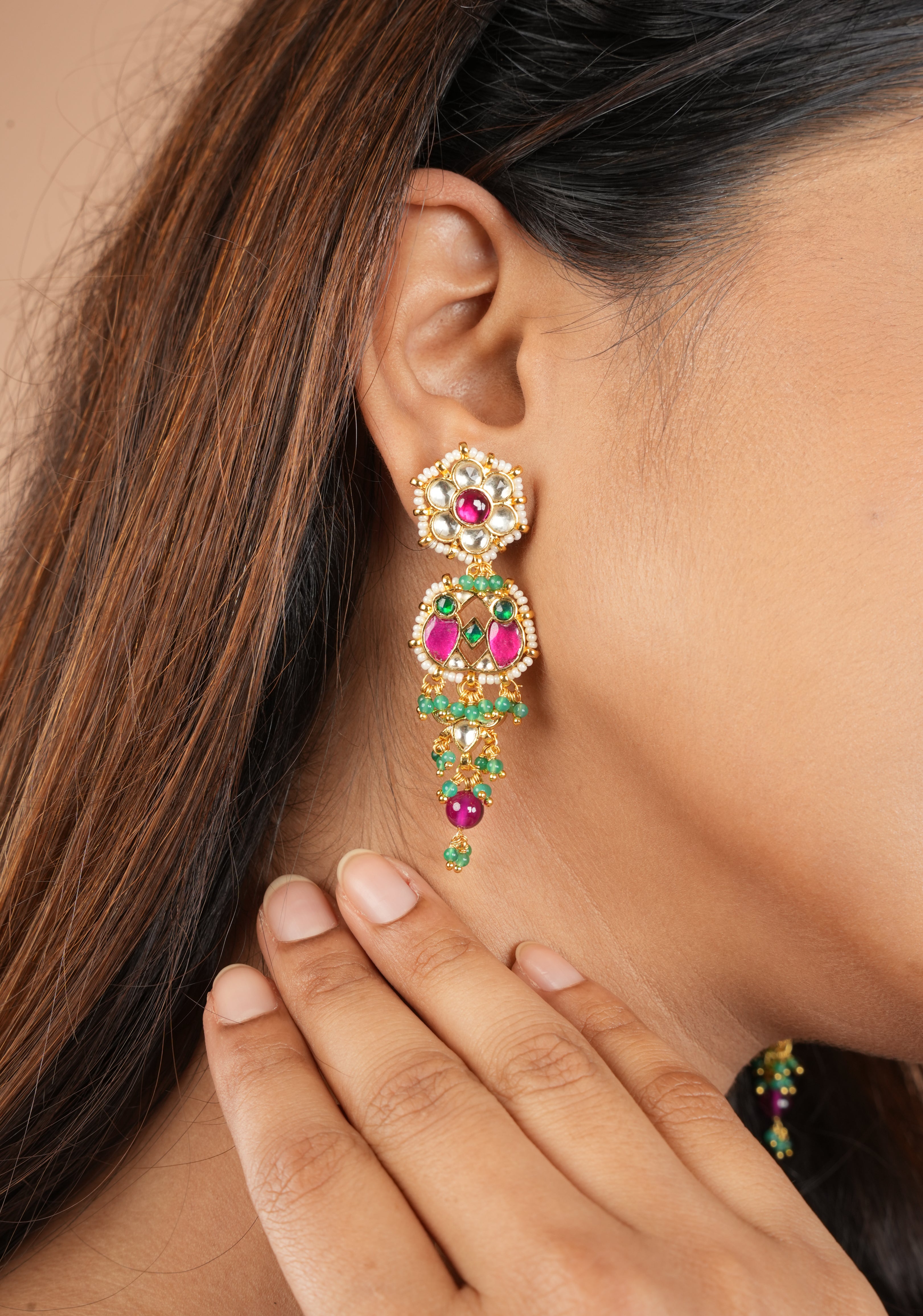 Earrings with flower  embedded in Jadau technique and dangling beads