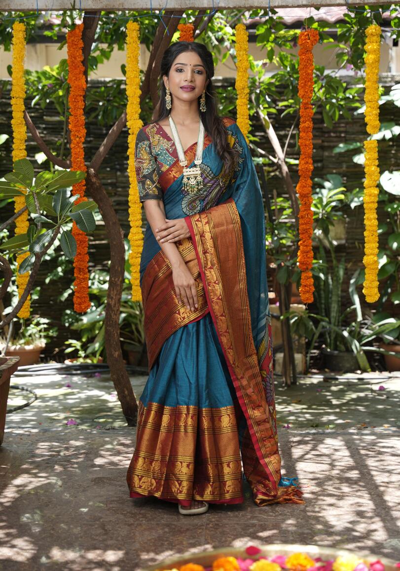 Peacock blue Narayanpet saree with pen kalamkari appliqué and wide zari borders