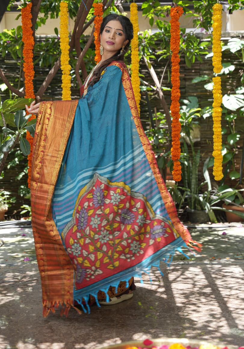 Peacock blue Narayanpet saree with pen kalamkari appliqué and wide zari borders