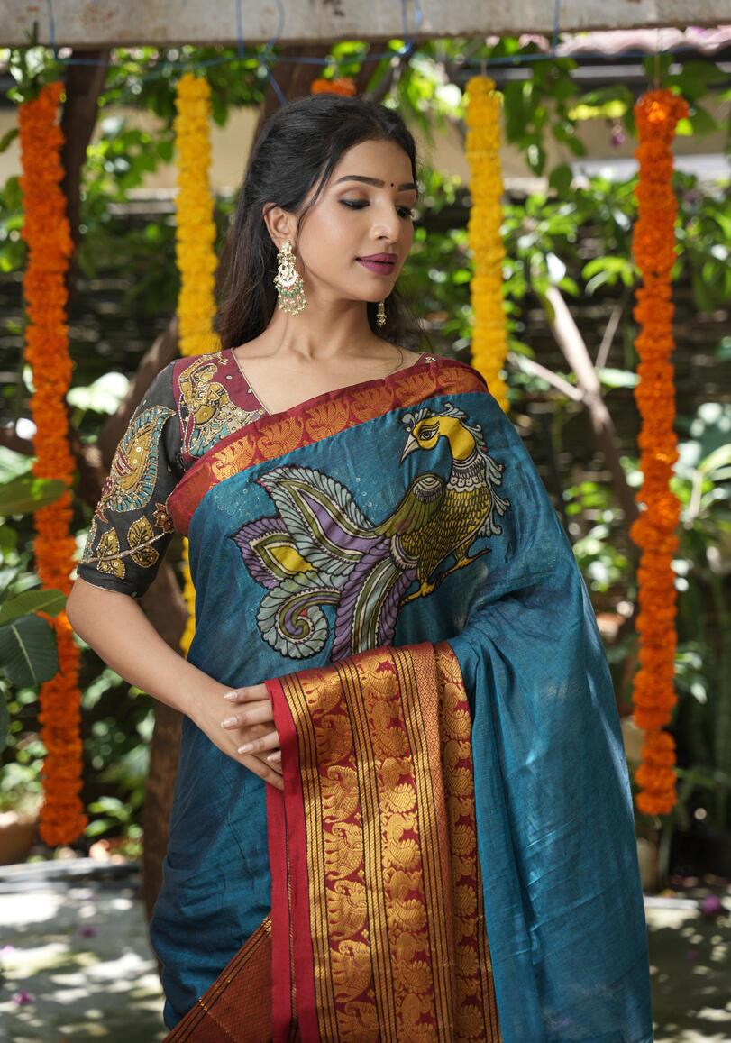 Peacock blue Narayanpet saree with pen kalamkari appliqué and wide zari borders