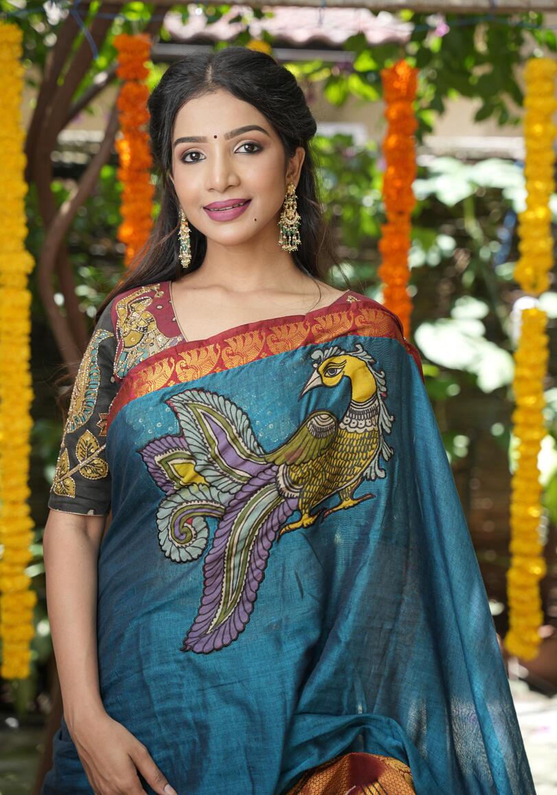 Peacock blue Narayanpet saree with pen kalamkari appliqué and wide zari borders