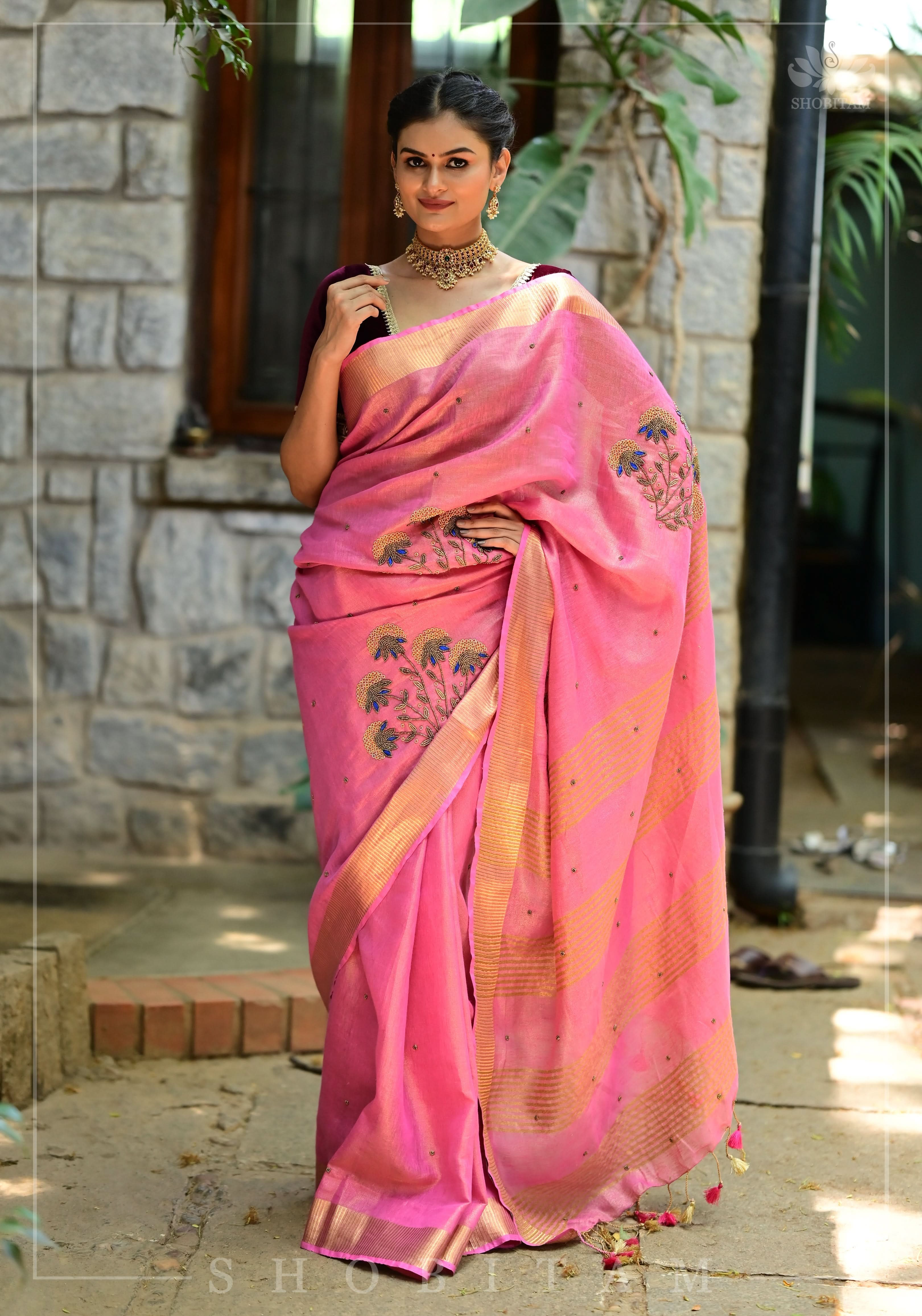 Bead and embroidery handwork on Tissue Linen Saree in Pink and Gold Tissue