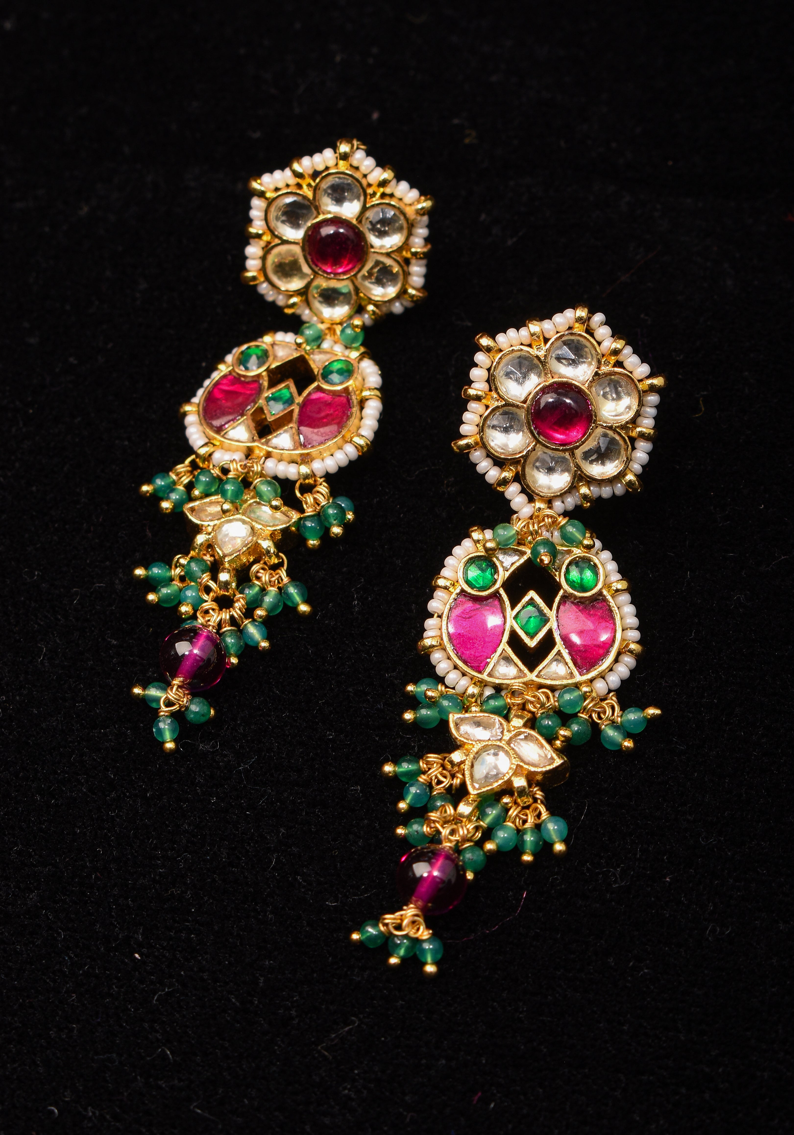 Earrings with flower  embedded in Jadau technique and dangling beads