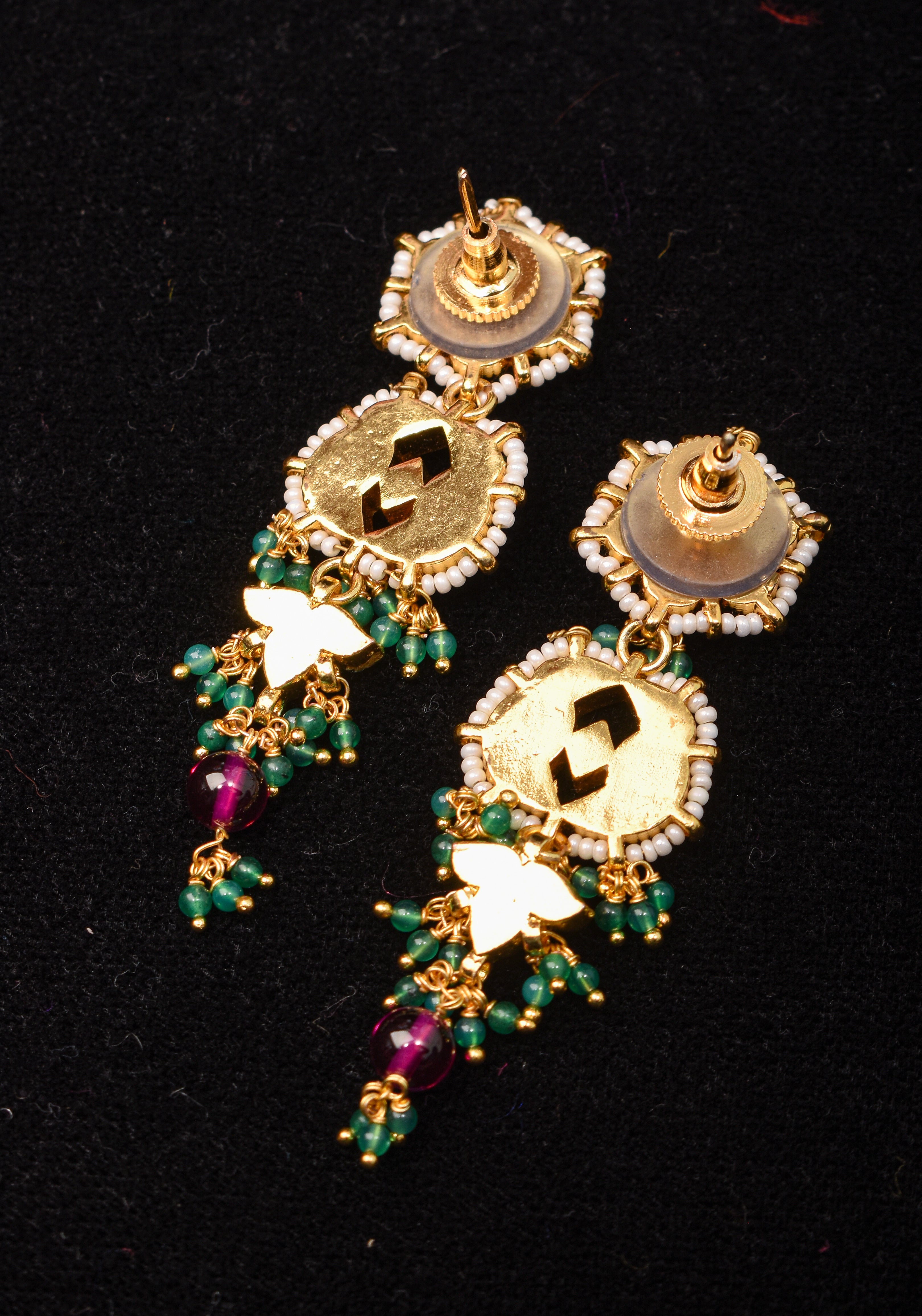 Earrings with flower  embedded in Jadau technique and dangling beads