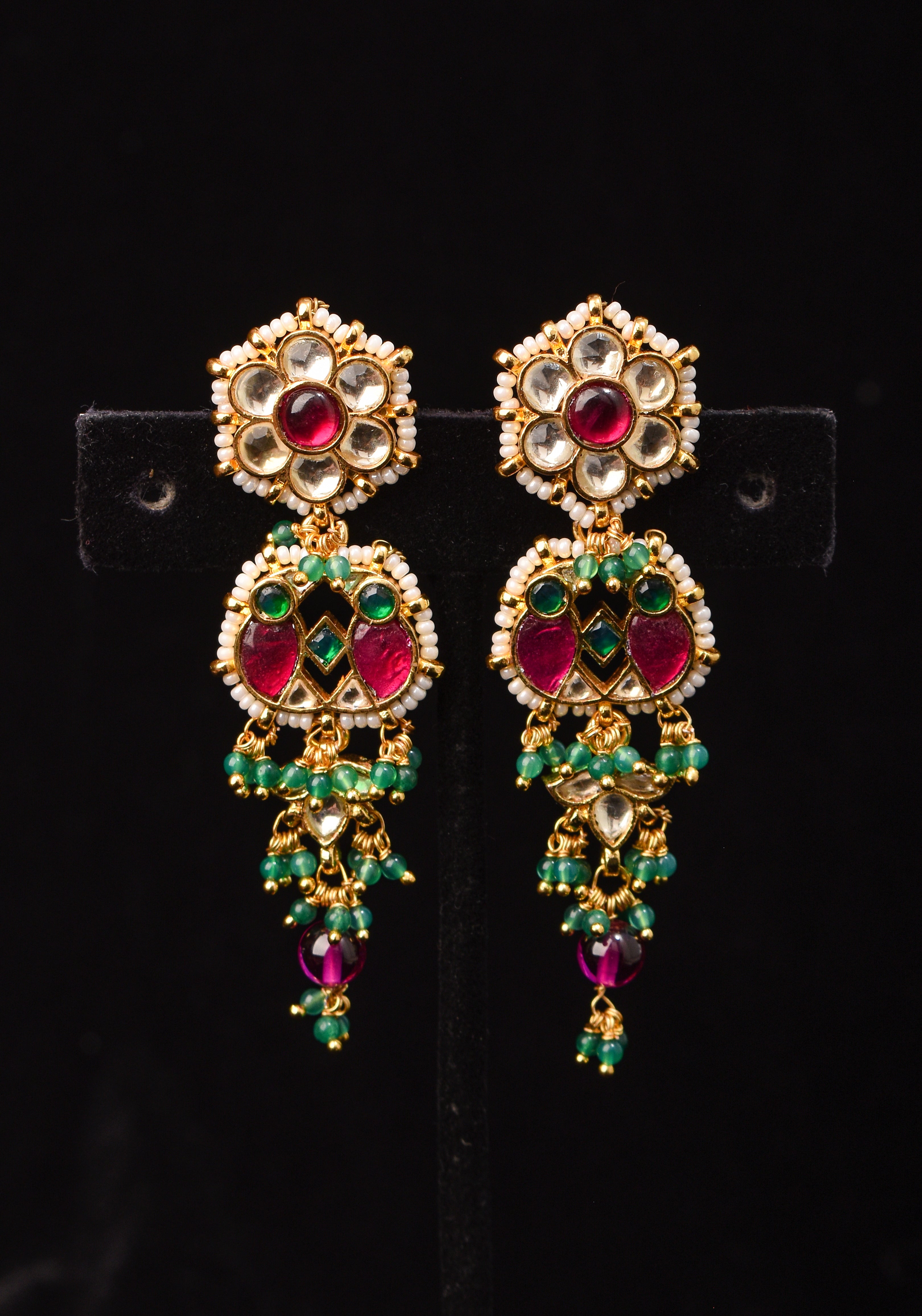 Earrings with flower  embedded in Jadau technique and dangling beads