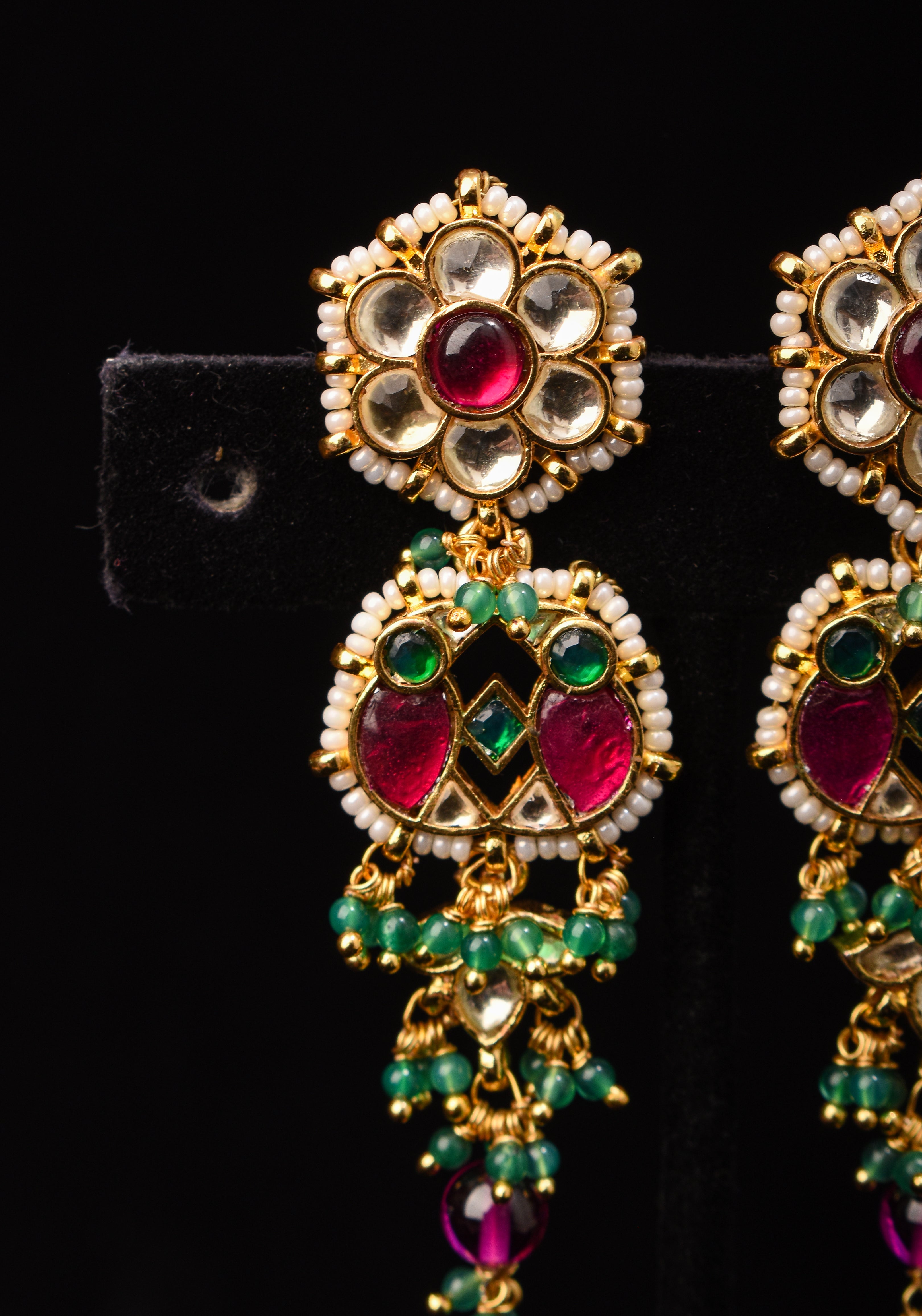 Earrings with flower  embedded in Jadau technique and dangling beads